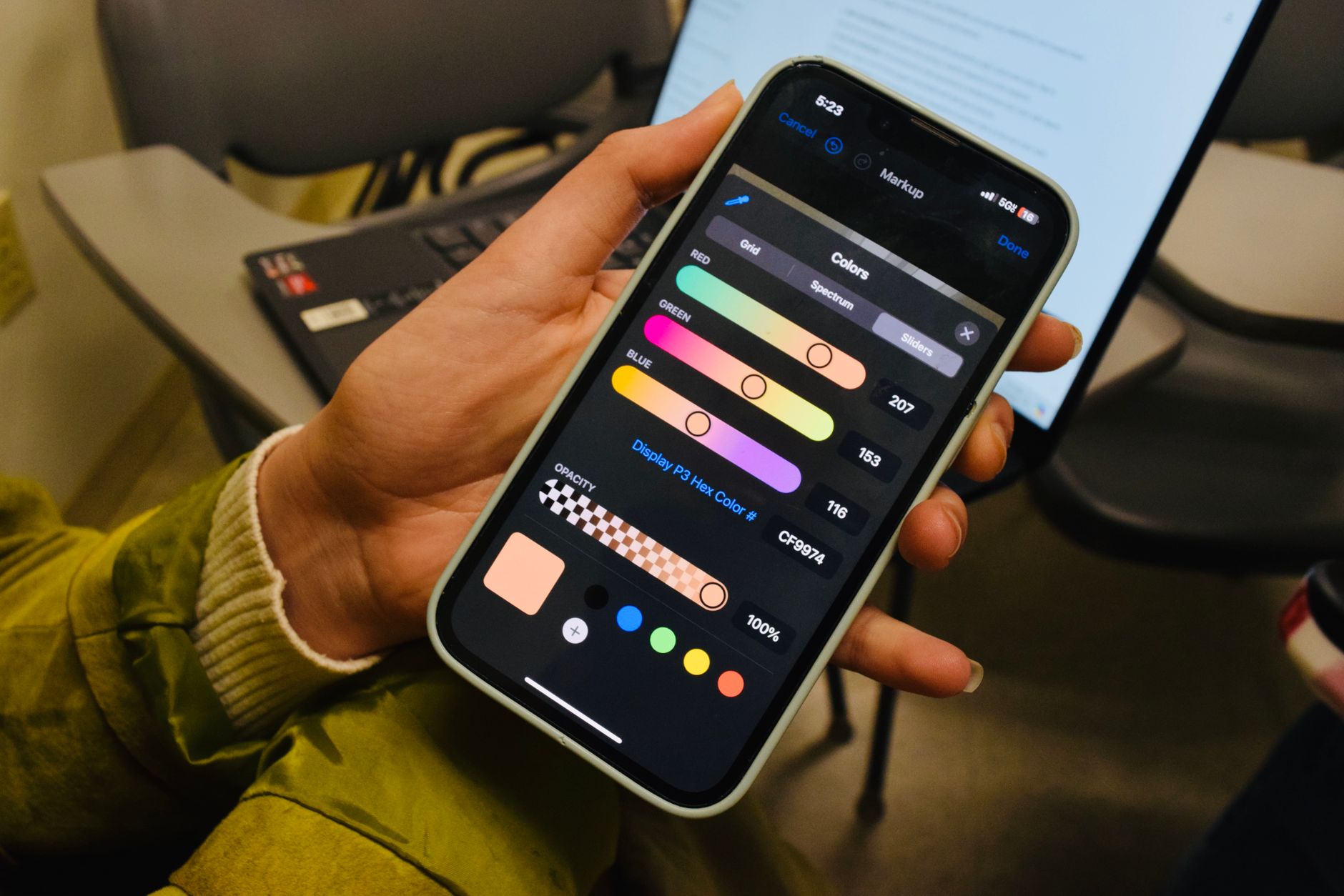 A hand tapping settings controls on a smartphone screen
